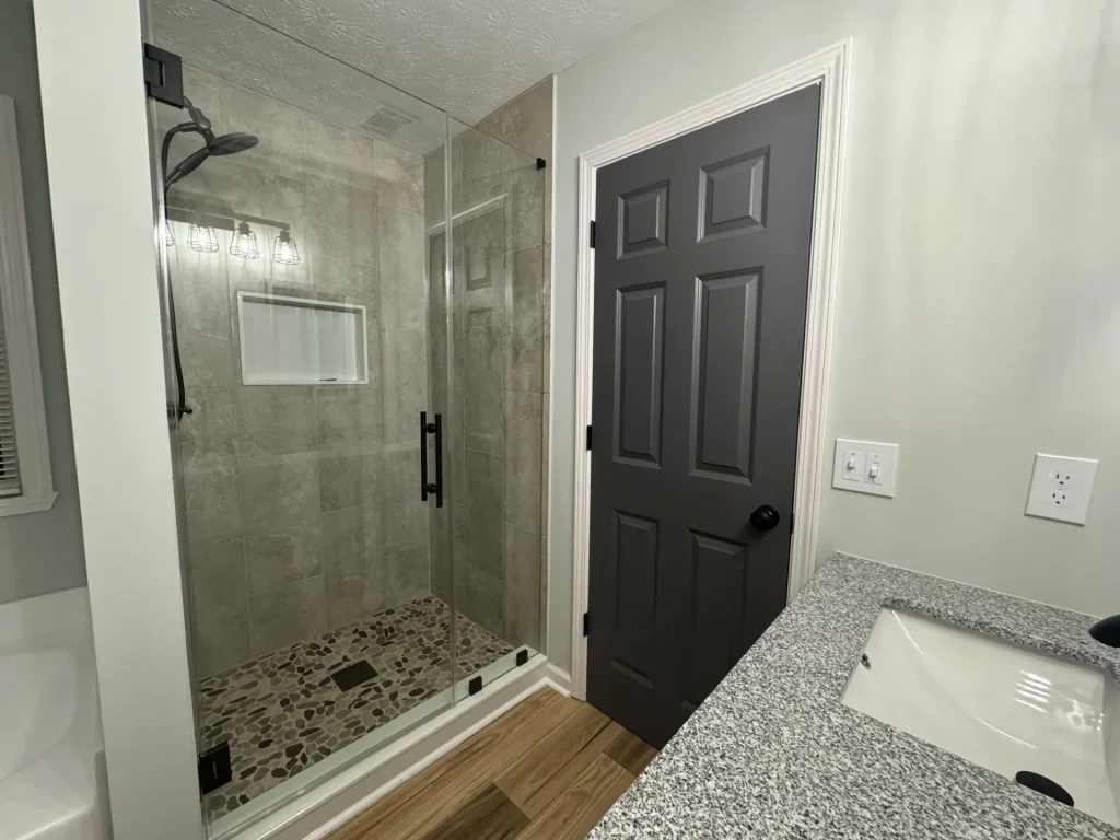 After bathroom remodeling in Monroe home, featuring updated fixtures and moisture-proof design - Shower Remodeling Service