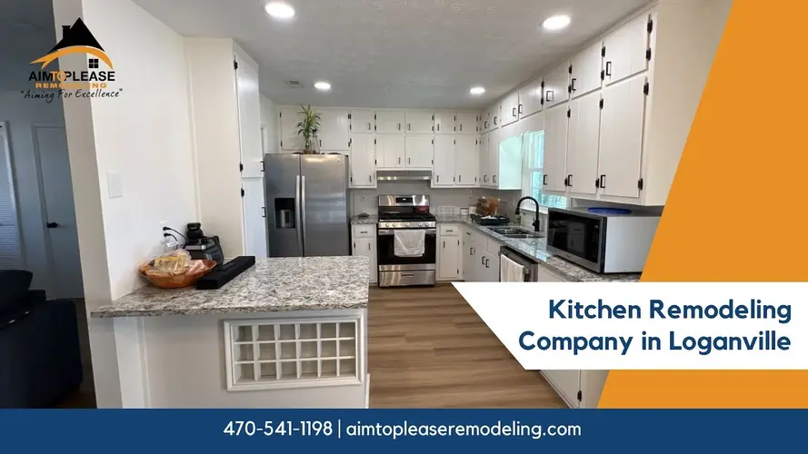 Spacious remodeled kitchen featuring white cabinetry, center island, and wood flooring