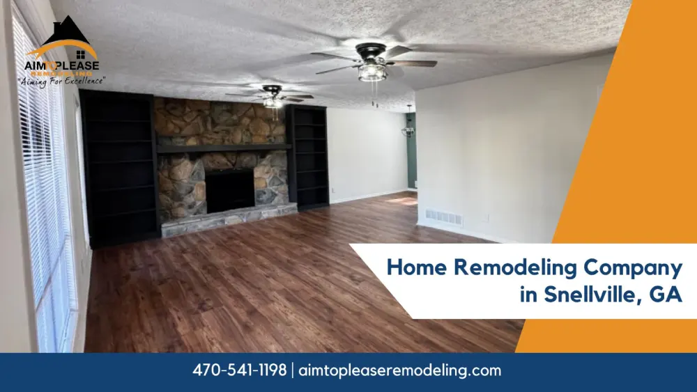 Modern living room with wood flooring, stone fireplace, and ceiling fans after remodel